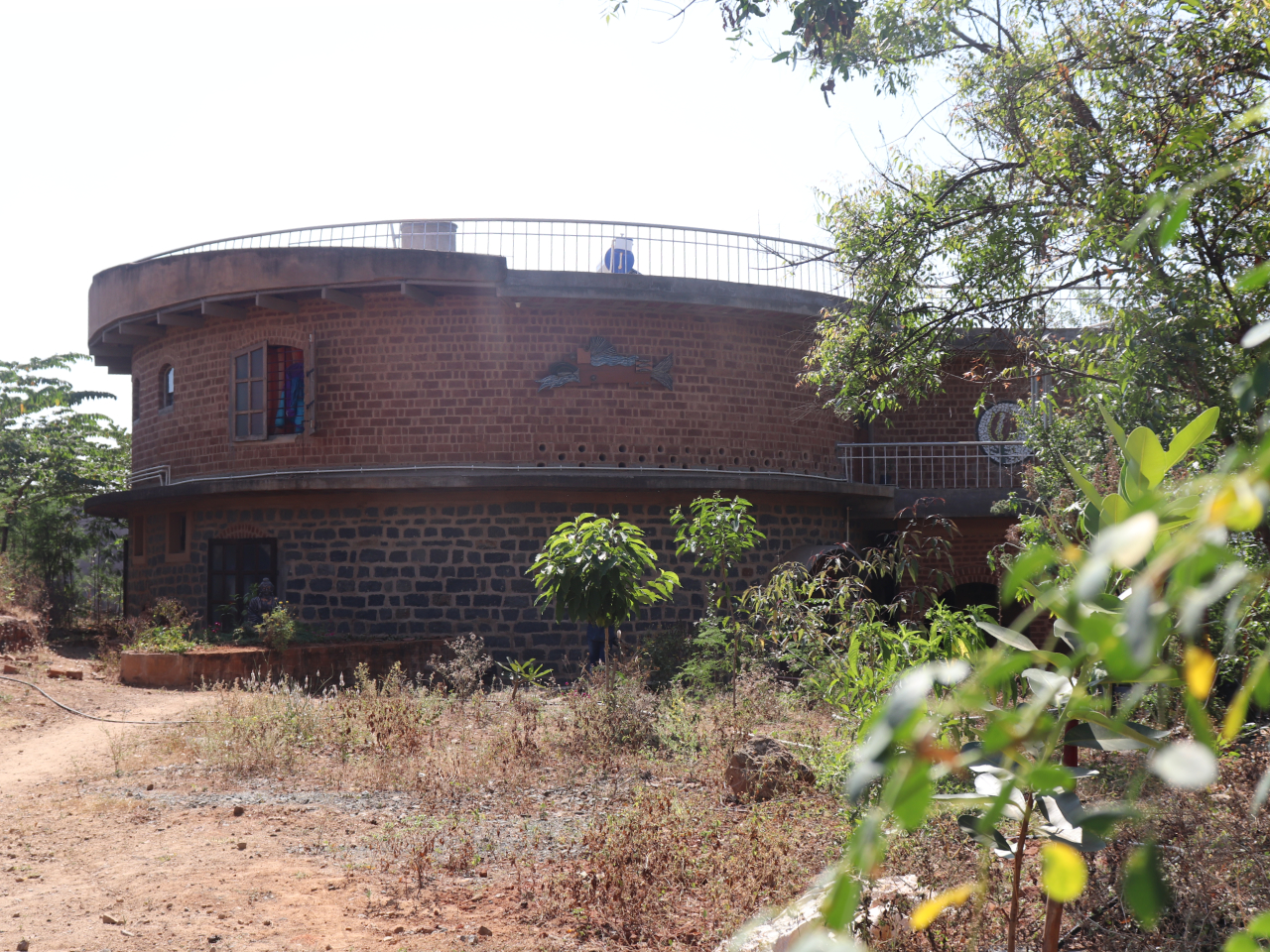 Suresh & Geetha’s house, Dharmapuri - A load bearing structure with stone and cob walls, filler slab roof, and madras terrace in mud mortar. Water harvesting tank in the central courtyard , composting toilets and grey water recycling.  Area 3200 sqft ; Total cost 35,00,000/-
