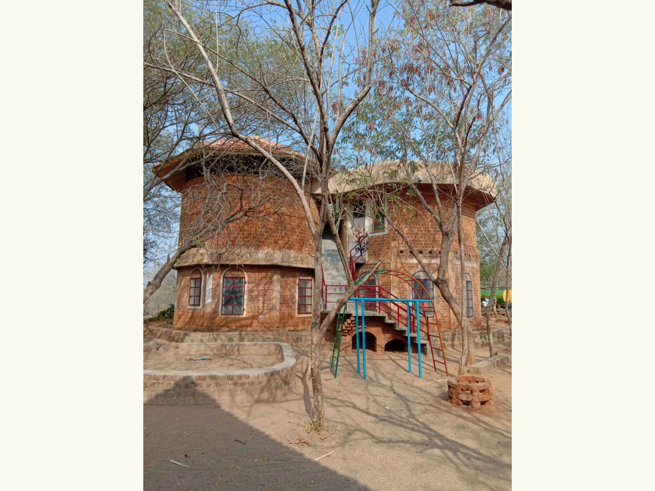 Puvidham Learning Centre, Dharmapuri -  a load bearing structure with country burnt brick in mud mortar on ground floor and country burnt brick in rattrap bond on first floor. Total Area is 1600sq feet; Total cost  18000/-
